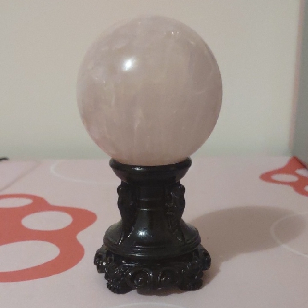 Elegant Rose Quartz Sphere on Black Stand